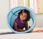 Toddler inside a toy tunnel